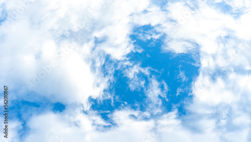 Blue sky with swirl wind cloud on daylight background