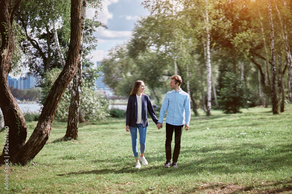 happy couple in love walking holding hands. happy couple in love walking holding hands.