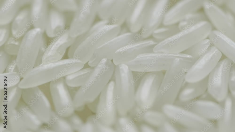 Close up of uncooked white rice falling. Close up of uncooked white rice falling.