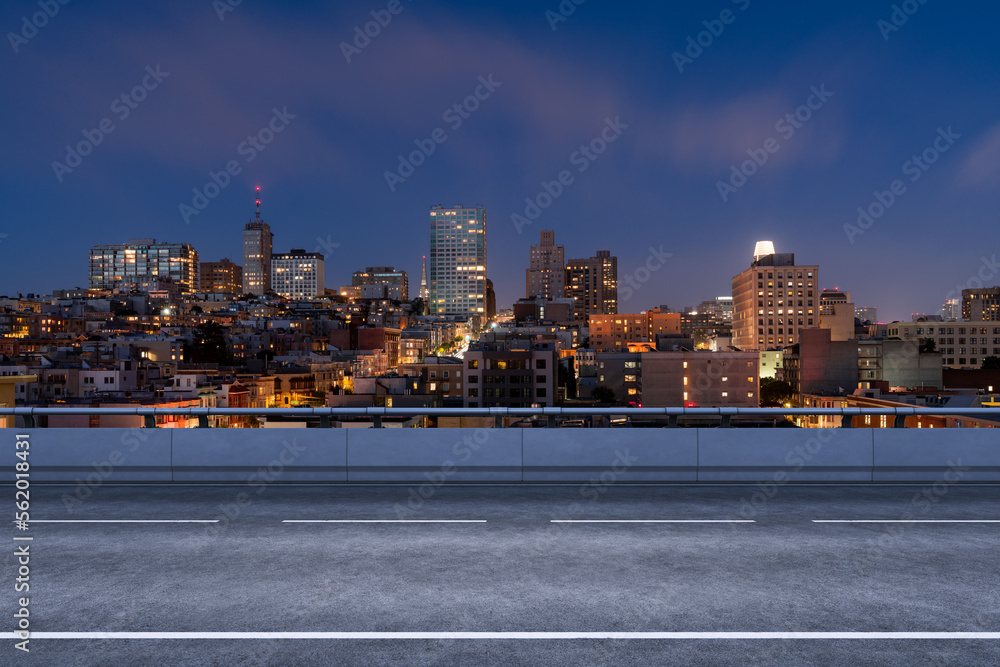 Obraz premium Empty urban asphalt road exterior with city buildings background. New modern highway concrete construction. Concept way to success. Transportation logistic industry fast delivery. San Francisco. USA.
