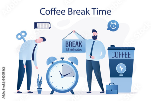 Tired businessman near big mug of coffee and alarm clock. Boss gives 15 minutes coffee break for employee. Male entrepreneur recharges low battery, charge of energy. Time management