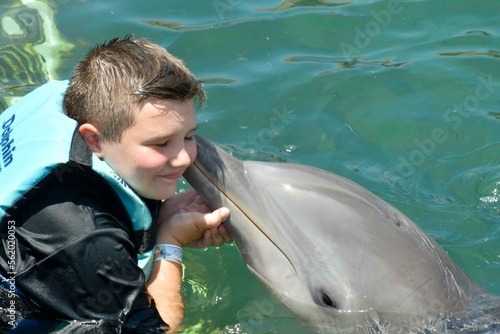 Boy kissing Dolphin