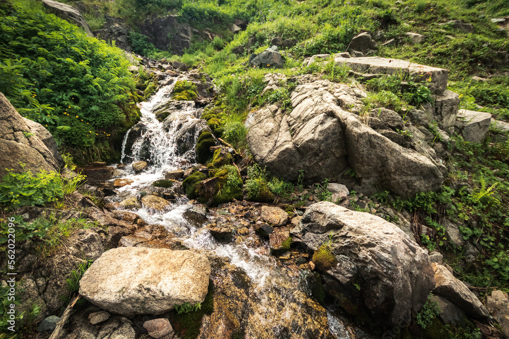 Picturesque nature in the vicinity of Almaty - Qimasar Waterfall in the Kimasar Gorge. Tourist natural places of Kazakhstan. Picturesque nature in the vicinity of Almaty - Qimasar Waterfall in the Kimasar Gorge. Tourist natural places of Kazakhstan.