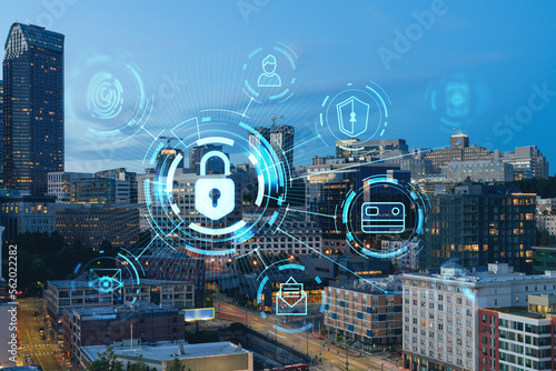 Seattle aerial skyline panorama of downtown skyscrapers at sunset, Washington USA. The concept of cyber security to protect confidential information, padlock hologram