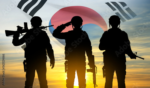 Silhouettes of soldiers on background of sunset and South Korea flag. Armed forces of Korea. Background for Memorial Day, Liberation Day. EPS10 vector photo