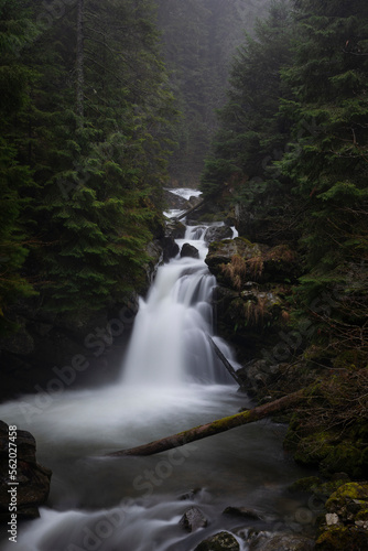 Fototapeta Naklejka Na Ścianę i Meble -  Sucu waterfall flowing through rocks in a deep forest