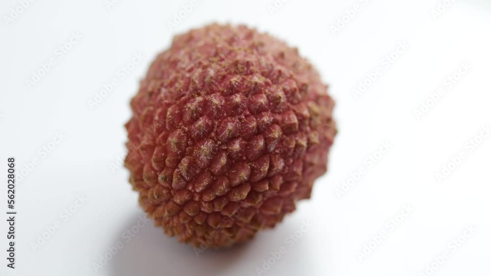 Exotic lychee berry spins on white background Exotic lychee berry spins on white background