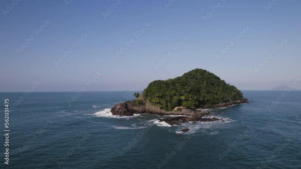 Drone flying over the acoean going towards an island Drone flying over the acoean going towards an island