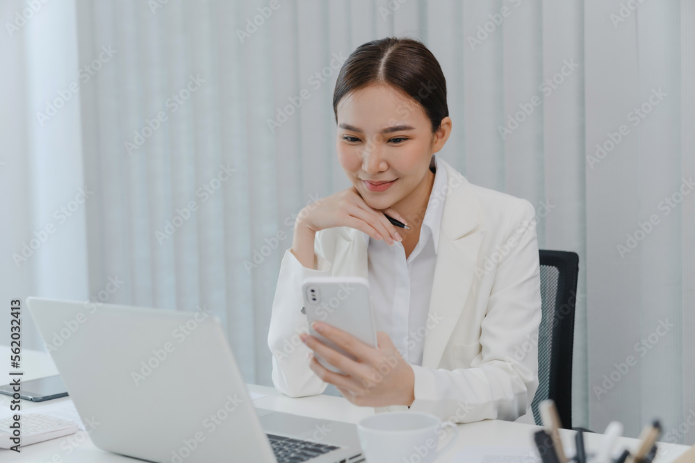 Confident young asian businesswoman working on mobile phone Start up small business owner. business successful technology concept Confident young asian businesswoman working on mobile phone Start up small business owner. business successful technology concept