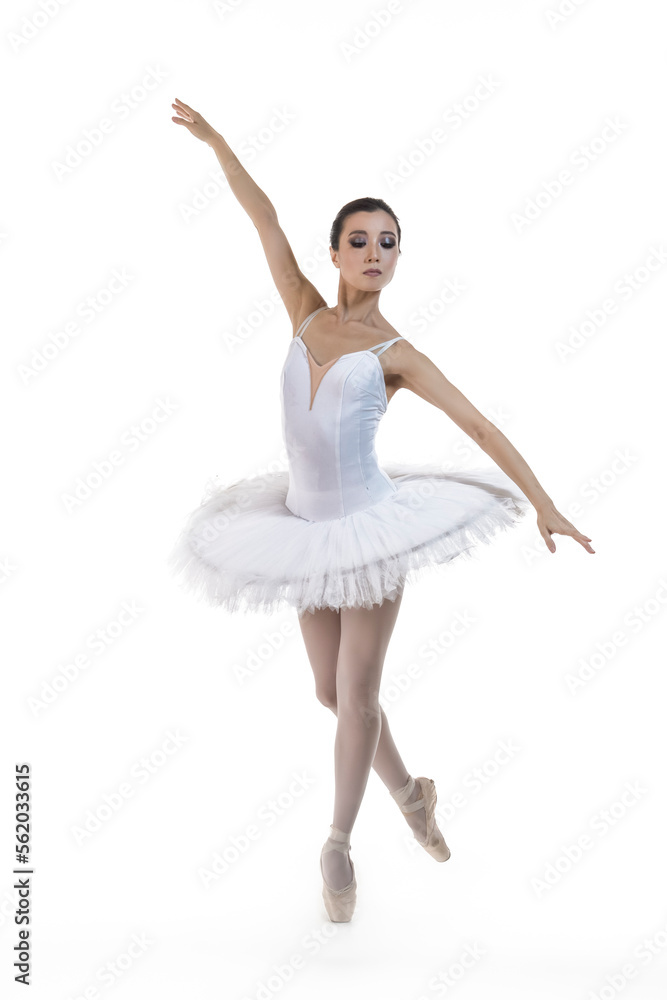 Dance Concepts. Professional Asian Japanese Female Ballet Dancer in White Tutu With Lifted Hands Against White Background. Dance Concepts. Professional Asian Japanese Female Ballet Dancer in White Tutu With Lifted Hands Against White Background.