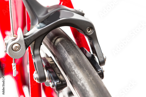 Bicycle Concept. Partial View of Professional Road Bike Wheel With Brake Calipers. Against White.