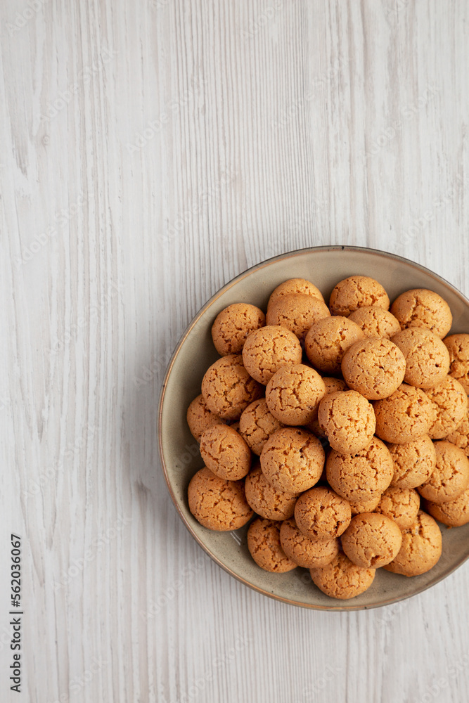 Homemade Italian Amaretti Cookie Biscuits on a Plate, top view. From above, overhead, flat lay. Copy space. Homemade Italian Amaretti Cookie Biscuits on a Plate, top view. From above, overhead, flat lay. Copy space.