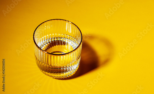 Foto Glasses with water on yellow background with copy space