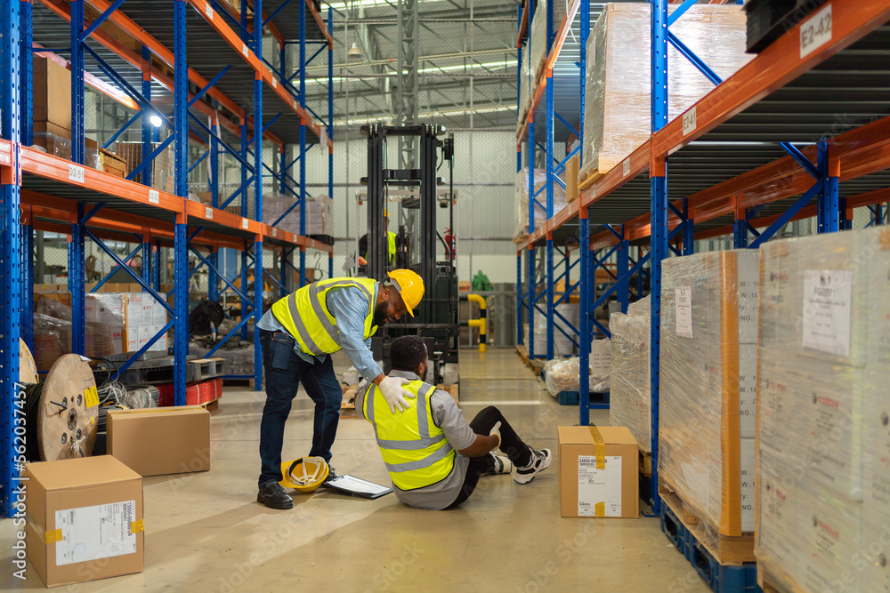 A worker got accident in large warehouse retail store industry. Rack of stock storage. Interior of cargo in ecommerce and logistic concept. Depot. People lifestyle. Shipment service. Safety. - obrazy, fototapety, plakaty 