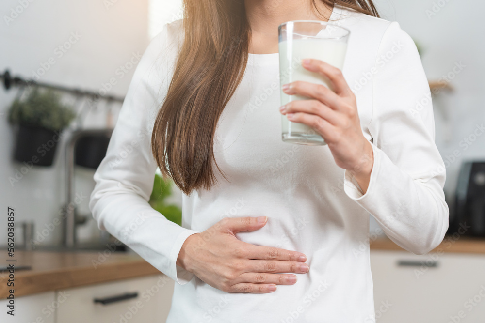 Pain, suffering asian young woman having a stomachache, abdominal pain