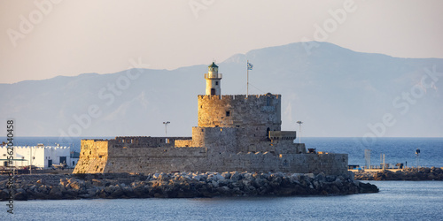 Lighthouse on the Mediterranean Sea in Rhodes, Greece. Sunny Evening. © edb3_16