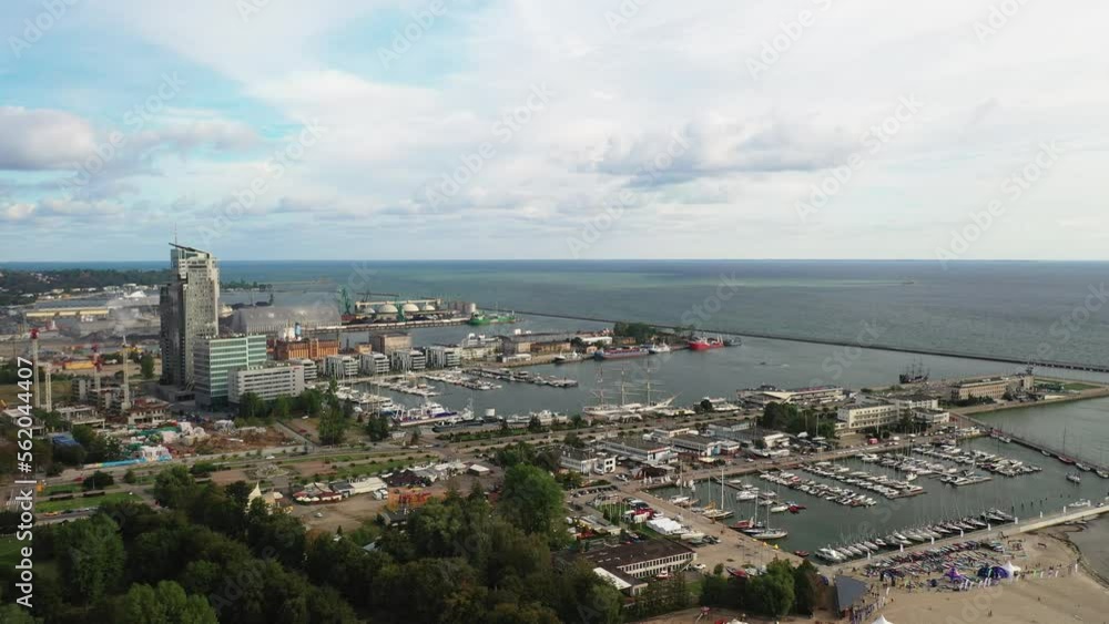 Drone aerial view panning right docks, marina, and boats in port city of Gdynia Poland Drone aerial view panning right docks, marina, and boats in port city of Gdynia Poland