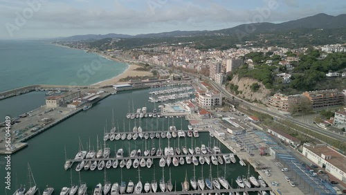 Arenys de Mar marina in the Maresme province of Barcelona small boats moored fishing village aerial images photo