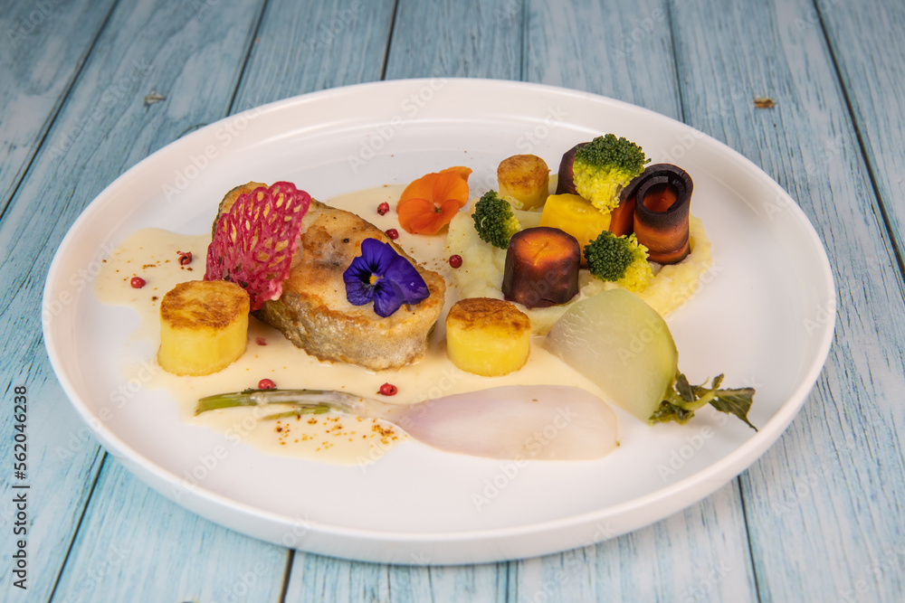 Recipe of cod steak, mashed potatoes and its farandole of vegetables, parsnip, turnip, broccoli, candied potato. High quality photo Recipe of cod steak, mashed potatoes and its farandole of vegetables, parsnip, turnip, broccoli, candied potato. High quality photo