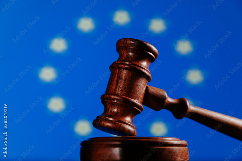 Flag of European Union and wooden judge gavel. Law concept Flag of European Union and wooden judge gavel. Law concept