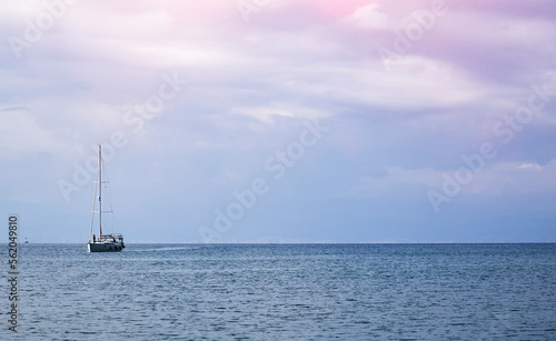 boat on the Aegean sea with beautiful blue pink skies 