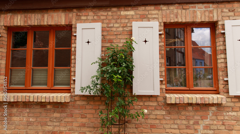 Windows in old houses, wooden. frames and shutters on the windows in the village.
