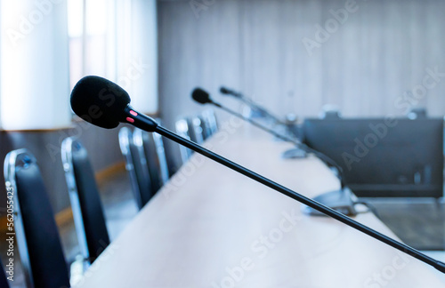 Close up microphone on brown table in meeting room