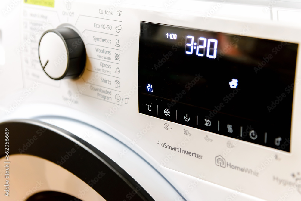 Domestic Display washing dryer machine. Macro photo part of modern home washing dryer machine dial. Domestic Display washing dryer machine. Macro photo part of modern home washing dryer machine dial.