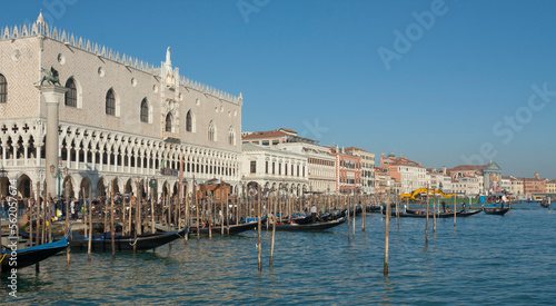 VENICE, ITALY - FEBRAURY 14, 2020: Doge's palace and gondolars on water.