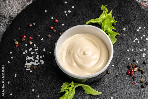 tasty white sauce on a dark background. banner, menu, recipe place for text, top view photo