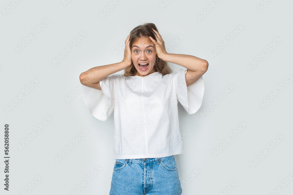 Surprised woman with hands oon hgand amazed by unexpected news holding showing happy expression isolated over white background. Surprised woman with hands oon hgand amazed by unexpected news holding showing happy expression isolated over white background.