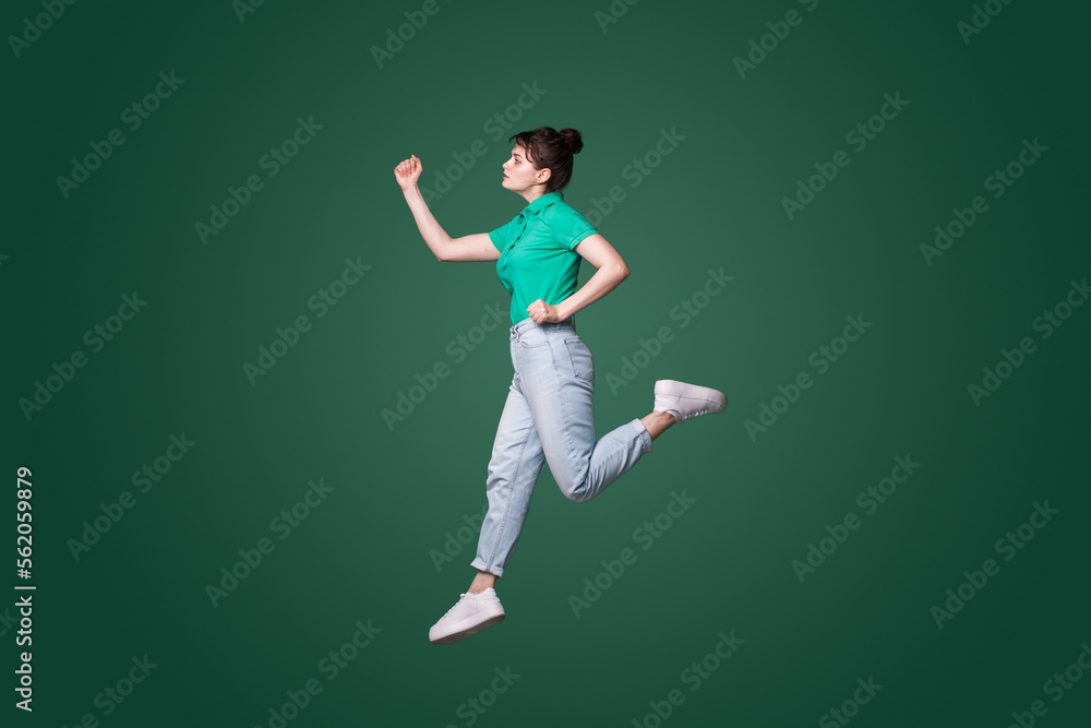 Full size profile photo of attractive woman runaway wanting to come first in the morning isolated green color background.