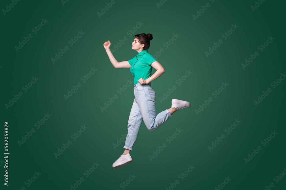 Full size profile photo of attractive woman runaway wanting to come first in the morning isolated green color background. Full size profile photo of attractive woman runaway wanting to come first in the morning isolated green color background.