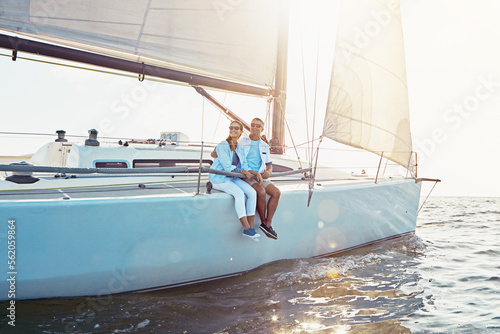Happy couple, boat and cruise on ocean in summer sunshine, love and romance on outdoor adventure. Couple, yacht and sea with waves, bonding and peace with luxury, lifestyle and travel for vacation