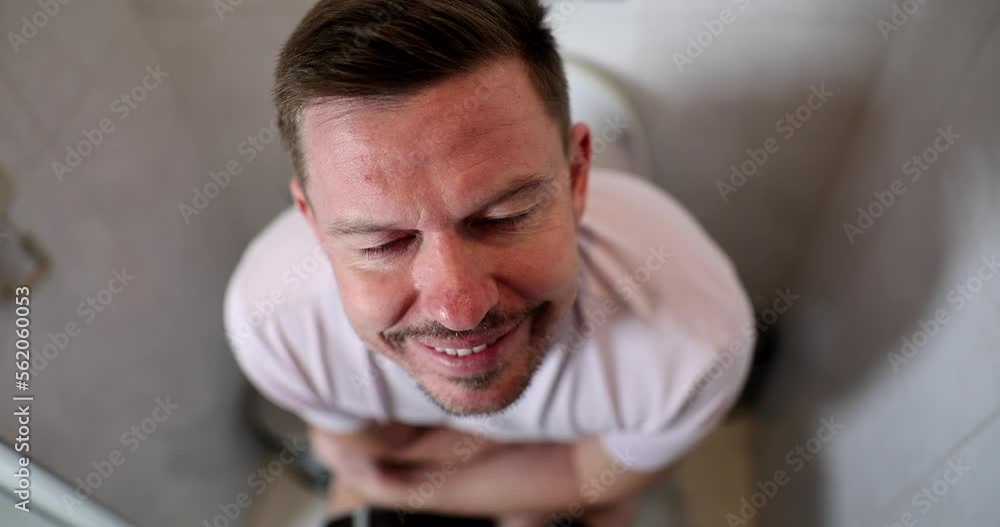 Man pushing on toilet with constipation and hemorrhoids 4k movie slow motion Man pushing on toilet with constipation and hemorrhoids 4k movie slow motion