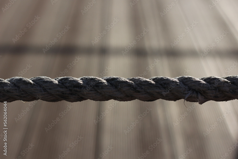 a sea rope stretched in a line against the background of lines going to the horizon