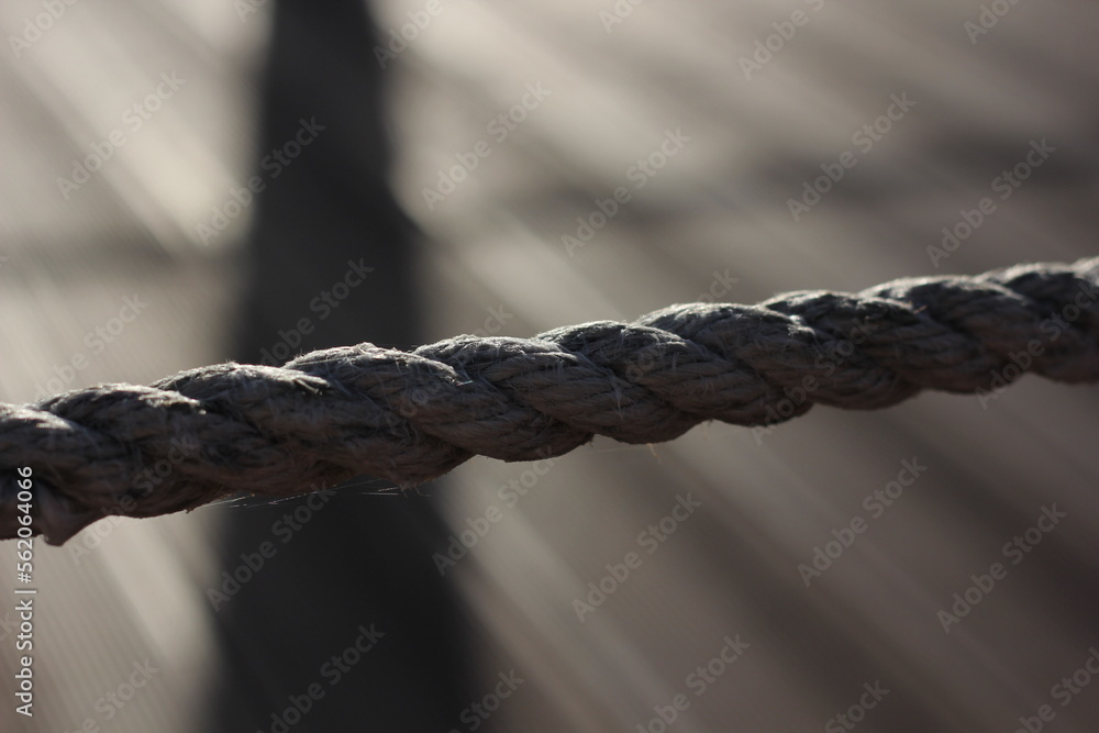 a sea rope stretched in a line against the background of lines going to the horizon