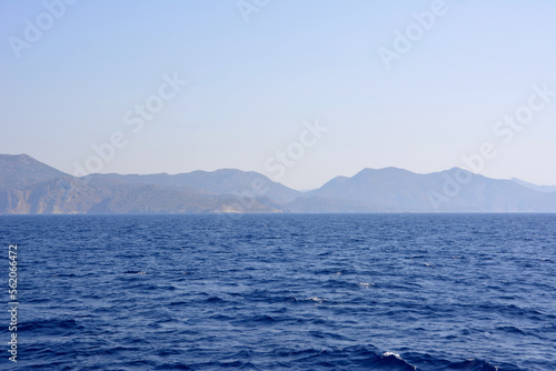 blue mediterranean sea with mountain range on background isolated