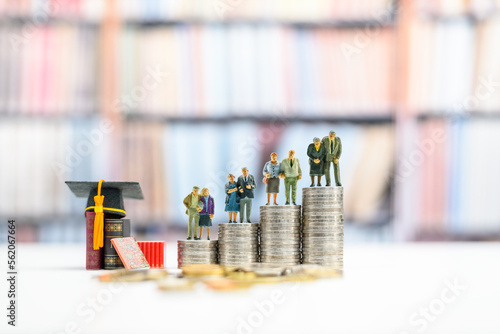 Lifelong learning or ongoing, voluntary and self-motivated pursuit of knowledge, educational concept : Four senior elder couple, greater aged person, older people stand atop rows of ascending coins.