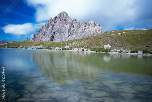 Obraz na płótnie Rocca la Meja, a mountain in the Cottian Alps, Piedmont, northern Italy, is reflected in the clear waters of an alpine lake on a clear summer day. w salonie