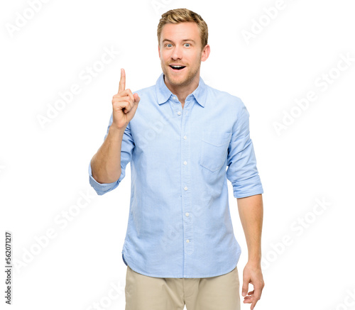 A handsome young man standing alone in the studio and pointing upwards isolated on a PNG background.