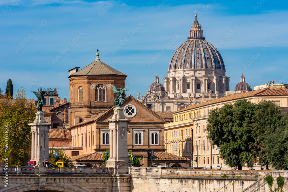 St. Peter's basilica dome in Vatican seen from Tiber river embankment, Rome, Italy
