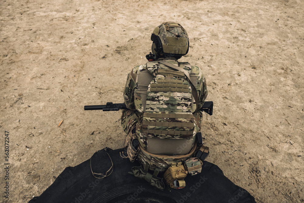 Soldier in camouflage having shooting training Soldier in camouflage having shooting training
