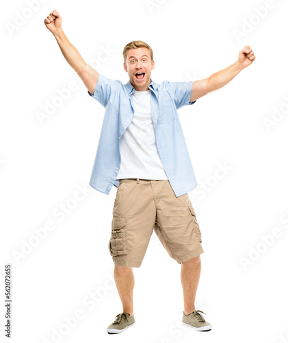A handsome young man standing alone in the studio with his arms raised in celebration isolated on a PNG background.