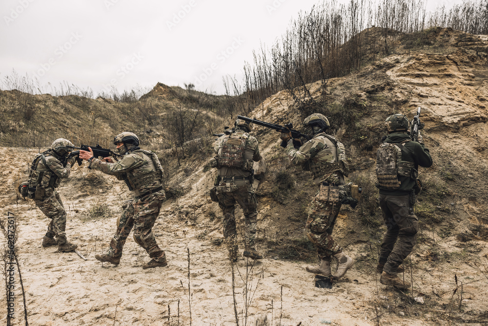 Soldiers on a shooting range looking concentrated and attentive Soldiers on a shooting range looking concentrated and attentive