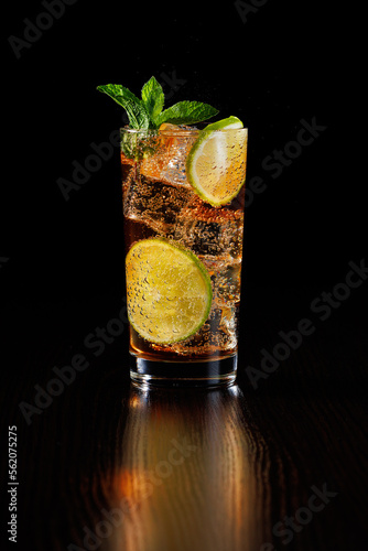 Photography Cold refreshing summer cocktail cuba libre or iced tea with lime