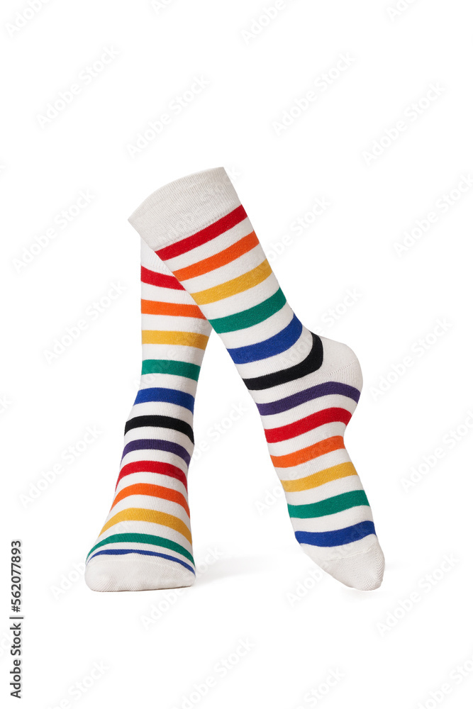 Detailed shot of bright colorful rainbow striped socks with a wide rubber band. The socks are shaped as walking human legs. The unisex striped socks are isolated on a white background. Detailed shot of bright colorful rainbow striped socks with a wide rubber band. The socks are shaped as walking human legs. The unisex striped socks are isolated on a white background.