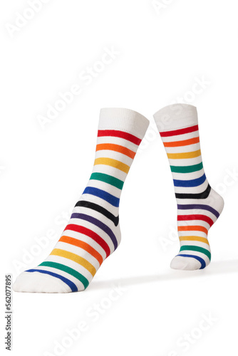 Detailed shot of bright colorful rainbow striped socks with a wide rubber band. The socks are shaped as human legs. The unisex striped socks are isolated on a white background.