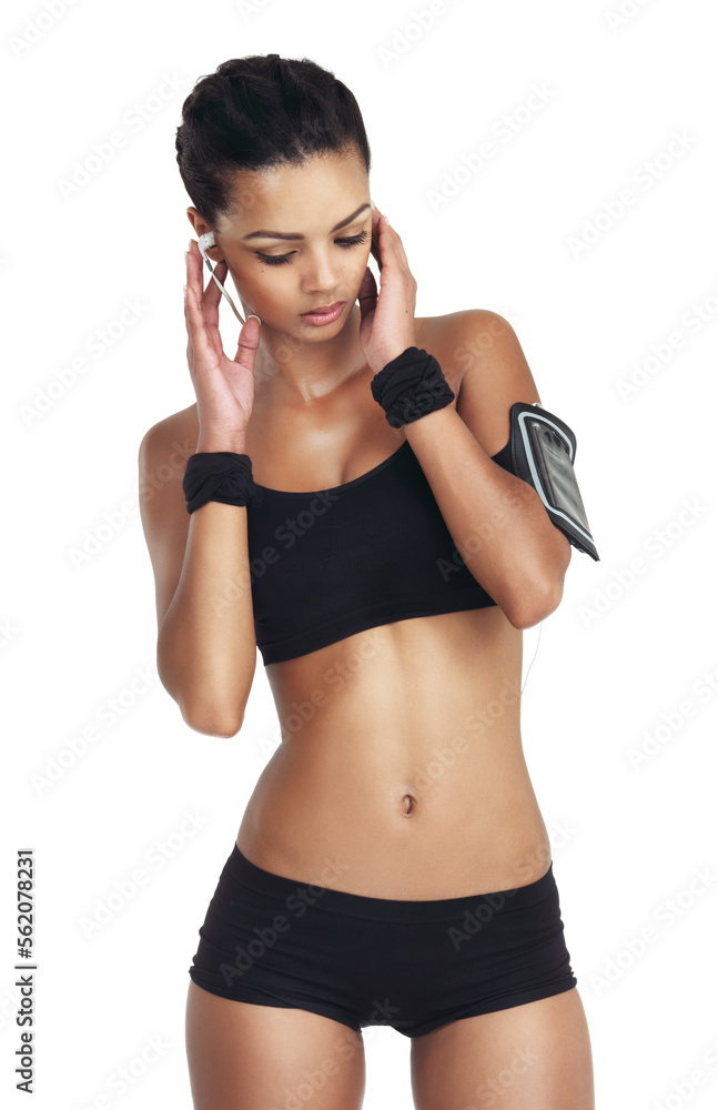 Music, fitness and sports with woman and phone for workout, health and cardio training. Podcast, mobile radio and motivation with isolated girl listening to earphones for exercise, streaming and goal - obrazy, fototapety, plakaty 
