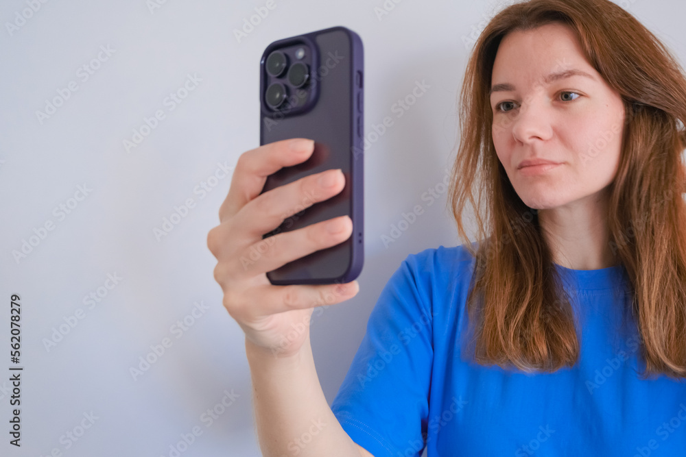woman with mobile phone on white background with copy space woman with mobile phone on white background with copy space